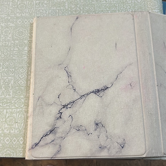 This a iPad case you can prop it up with any of the lines and the inside - Picture 2 of 5